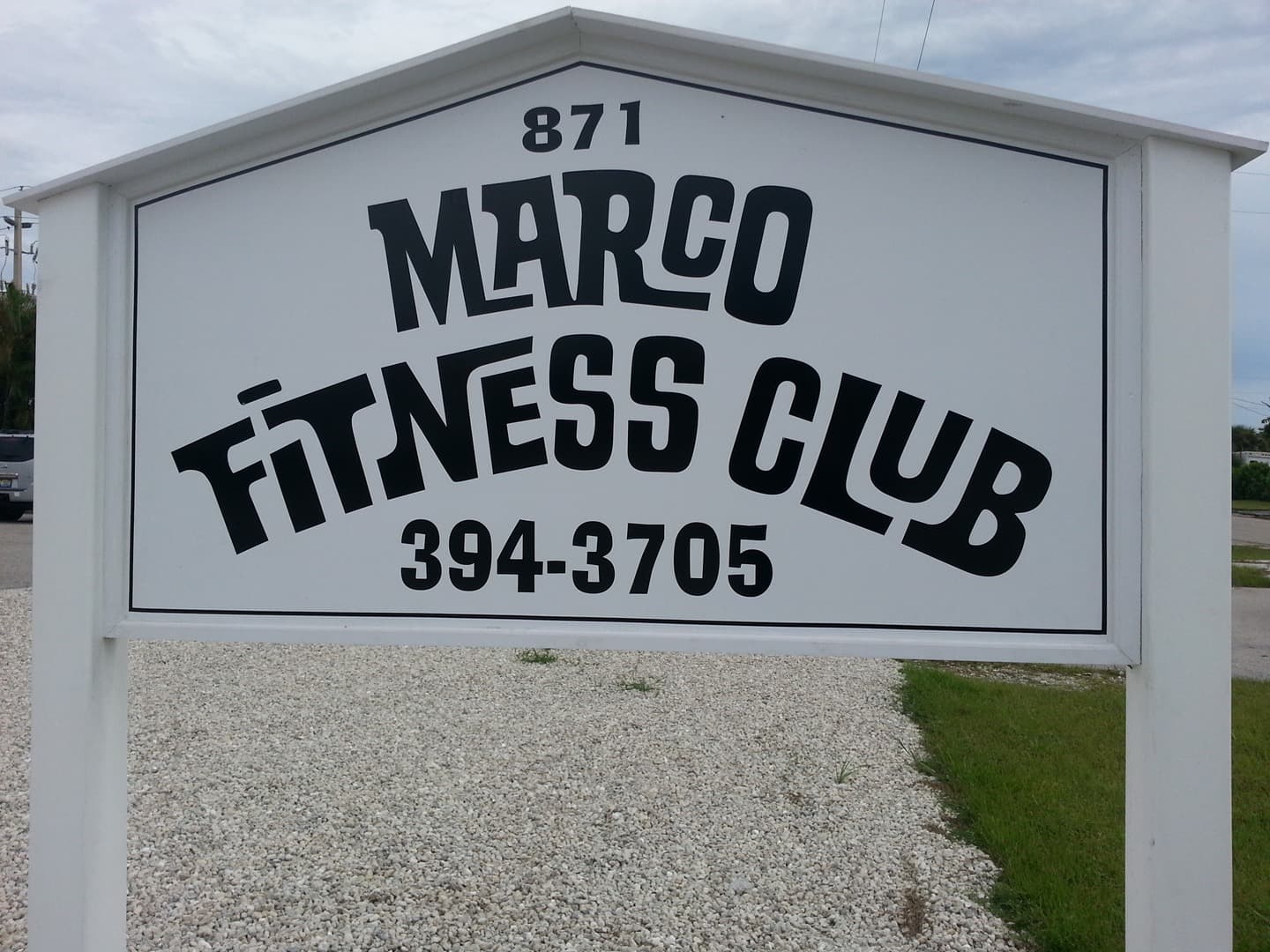 Marco Fitness Club road sign at 871 East Elkcam Circle, 394-3705